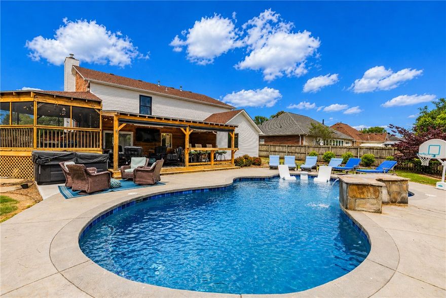 Amazing Outdoor Paradise!
Welcome to this beautifully upgraded home, where comfort, style, and outdoor living come together seamlessly.
Inside, you’ll find an open layout featuring 4 bedrooms with a primary suite on the main level, along with 2.5 bathrooms. The remodeled kitchen and bathrooms showcase quality finishes & timeless design, while upgrades throughout the home provide a move-in-ready experience. Additional features include newer windows, a tankless water heater, and a ventless washer/dryer. Step outside to a truly exceptional backyard retreat. Designed for year-round enjoyment, the home features two expansive covered outdoor living areas complete with heaters & automated shades. These spaces open to a stunning gunite pool, all surrounded by professional landscaping and a privacy fence on a large corner lot. Located in a highly convenient area with quick access to I-49 and close proximity to the Walmart Home Office, this property offers the perfect balance of accessibility and private outdoor luxury.