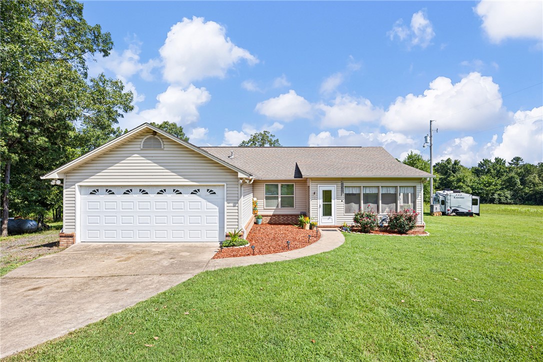 Welcome to your peaceful country escape on 21.66 acres of beautiful pastureland! This well-maintained 3-bedroom, 2-bath home offers 1,448 sq ft of comfortable living space, built in 2010 and thoughtfully updated. Outdoors, you'll find three 50-amp RV hookups, chicken coop, a 90x47 fenced garden ready for planting, and a 70x30 fenced backyard perfect for pets or play. Inside, youāll find a tankless on-demand water heater, built-in garage shelving, and a shelter room for added peace of mind. Whether you're looking to spread out, start a hobby farm, or just enjoy some fresh air and quiet, this property has room to live, grow, and relax.
