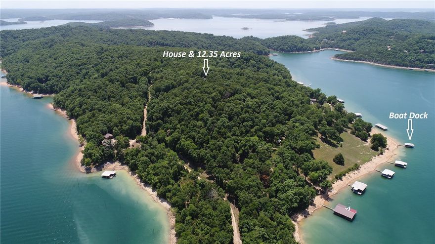 A lake home that you can call "Home" This Custom built home on 12.35 acres with a private boat dock it is a wonderful place to get away from it all. 3/4 bedrooms (game room or office can be made bedrooms) 4 full baths and one 1/2 bath. Soaring ceilings in the great room with a two-story wood burning fireplace and the views of the lake from this room are awesome, Custom built-ins everywhere. The country kitchen is framed with 8x8 white oak beams. The built-in ice maker is great for entertaining and the big island gives plenty of workspace. There are Views of the lake from master bedroom. The formal Dining room will impress your guest. The oversized utility room doubles as a craft room and has floor to ceiling custom storage cabinets. The wrap around porch is a wonderful place to sit and relax and entertain guest. The boat dock is just a short distance from the house. The dock has a lift and solar power. The dock is under review to be expanded to a two slip dock. Be sure to check out both video tours