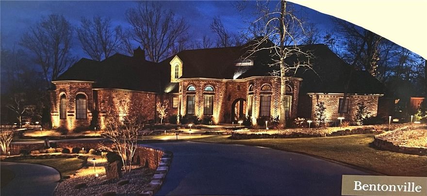 With 22' vaulted ceilings, beautifully distressed hardwood floors and a backyard built for entertaining, this home is truly a stunner! Enjoy taking your elevator down to the finished basement to the fully equipped wet bar and media/theater area. This 5 bedroom, 4.5 bath home has a fabulous master suite w/double walk-in closets, luxurious bathtub, walk-in shower and indoor hot tub. Located less than a mile from Crystal Bridges and a few minutes from everything downtown Bentonville has to offer!