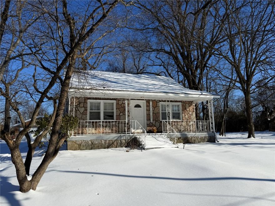 This charming 2-bedroom, 1-bath rock home is full of character and curb appeal. Featuring a timeless stone exterior and beautiful hardwood floors, this well-maintained home sits on a desirable corner lot and includes a detached 2-car garage. A perfect starter home, it offers both comfort and convenience—located just minutes from town, the park, and downtown amenities. A great opportunity to own a solid, classic home in a prime location.