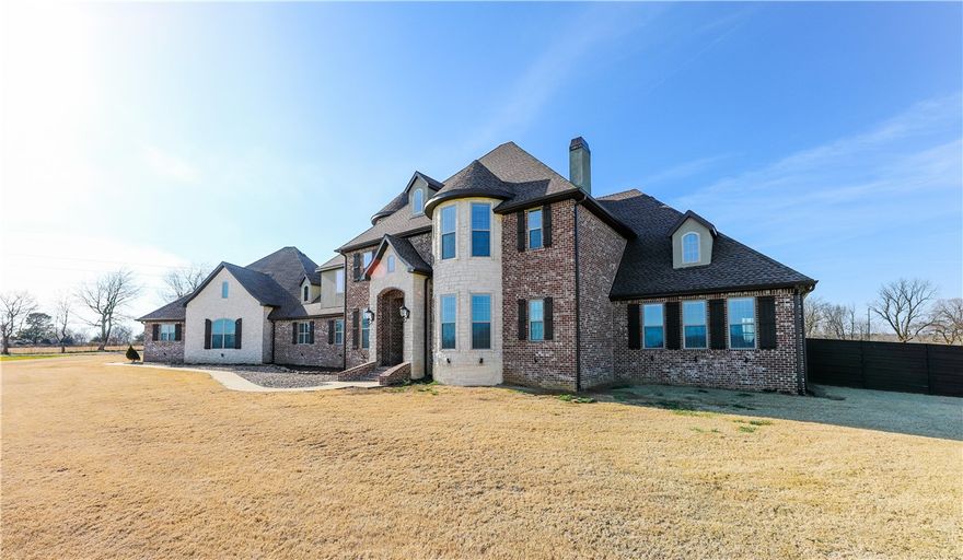 Absolutely stunning home on a beautiful 12-acre parcel! This is one fabulous property with a 4750 SF, 2-year-old gorgeous custom home with tremendous eye appeal! The custom built-in refrigerator conveys. It also includes a fenced-in 24x39 inground Gunite pool. The 3-car garage will accommodate up to six vehicles, and it has a lift system for overhead storage! Home is on public water plus there are two wells on the property. Farmington Schools. So many extras and so much to see - one of a kind! Check this one out! Close to town, yet it has a country feel. You have to see it to appreciate it!