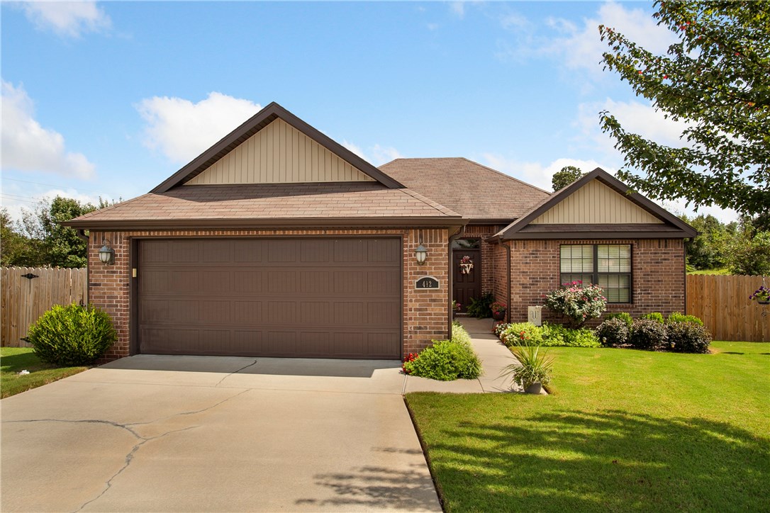 Beautiful, well maintained home on the inside and outside. Wood deck overlooks large fenced backyard with open field behind home. Easy access to all areas of Springdale and I-49. Great curb appeal. This hidden gem is a must see! Like new!