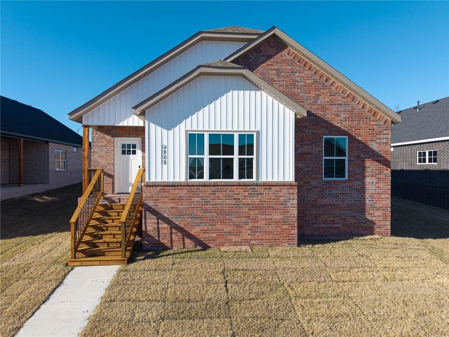This newly built home combines modern style with smart functionality, offering a flexible floor plan that can accommodate three bedrooms or two bedrooms plus a home office. Luxury vinyl plank flooring flows throughout the space, paired with granite countertops and sleek tiled showers in both bathrooms for a polished, contemporary feel. The open living area is highlighted by a warm fireplace, creating an inviting setting for relaxing evenings or entertaining guests. A thoughtfully designed kitchen connects seamlessly to the dining area, making everyday living both comfortable and convenient. With energy-efficient features, easy-care finishes, and a location in the growing Chaffee Cottages community, this home is designed to support a simple, stylish lifestyle.