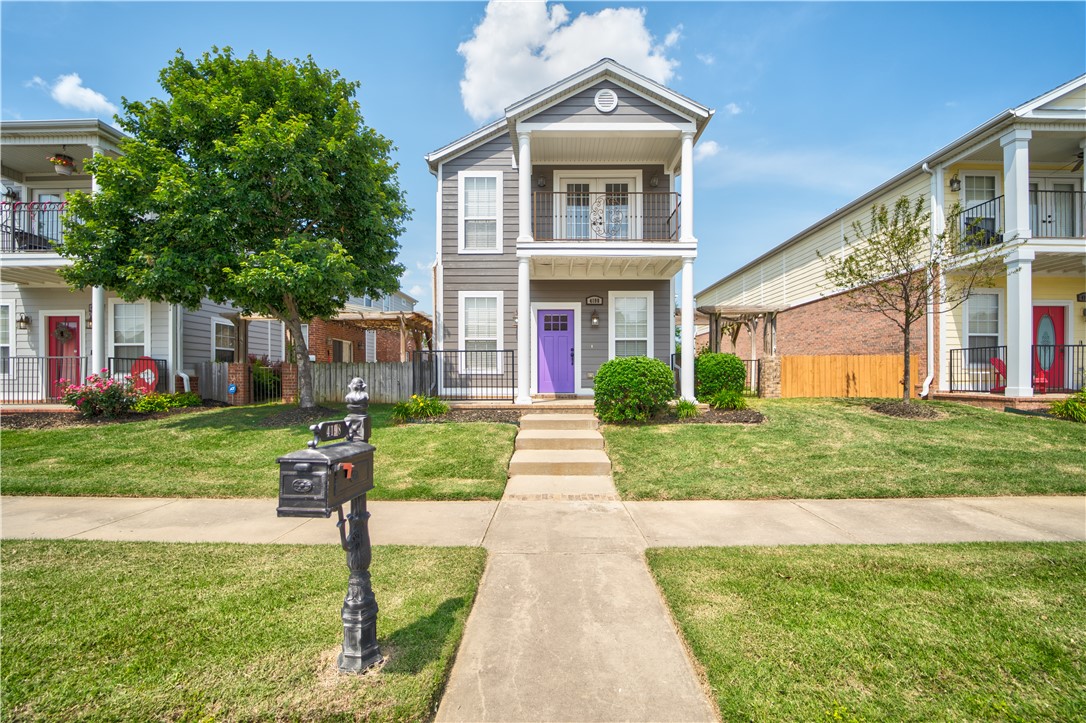 Charming Charleston-style home in West Fayetteville's Rupple Row Subdivision. Conveniently located near the route 35 bus stop and only 10 minutes from the UofA campus. The main level showcases a spacious living area with gas fireplace, wood floors, and abundant natural light. The kitchen allows for easy entertaining with wrap-around granite countertops, bar seating, and an additional dining room. Stainless steel appliances, gas range, and fridge are included. Upstairs, find a large master suite with a private walkout balcony, along with 2 additional bedrooms that share a Jack and Jill bathroom. Enjoy easy access to gyms, restaurants, boutiques, and entertainment. Landscape and yard maintenance are taken care of by the POA. A washer and dryer are included for your convenience. Pergola has been repaired. Interior and exterior paint (2023) HVAC (2019)