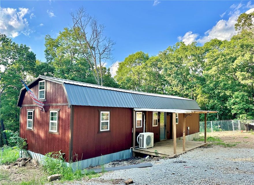 Great hunting property with a cabin already in place!  With almost 40 acres of beautiful land with a pond, wet weather creeks, cleared ATV trails, and plenty of wildlife you can't go wrong with this incredible property.  There is plenty to do on this beautiful land with an insulated shop/barn, a hunting stand by the pond, a smoke house a wood shed and a 300 yard shooting range.  The cabin is outfitted with everything you need to incredible weekend retreats or to live in while you build your dream home.   The cabin has a bottom floor with kitchen, bedroom, bathroom, laundry closet and a loft room.  It is outfitted with rock wool insulation, 2400 BTU mini split, whole house surge protection, Fisher mama bear wood stove and high speed internet access.  The shop is 36 x 40 and well insulated.  There are two electric meters on the property as well.  Also listed as MLS#1310924, 1310923, 1310426 & 1323154.
