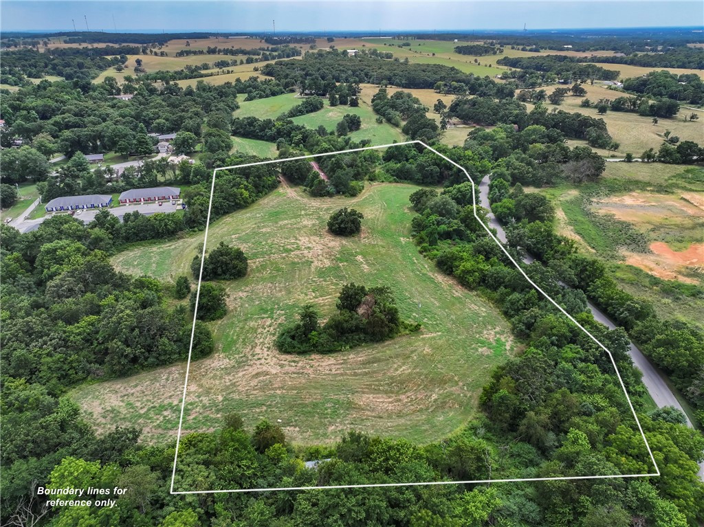 Perfect acreage to build your dream home on! 9.43 acres with multiple building sites, city water and sewer! Privately located but close to town! A must see!