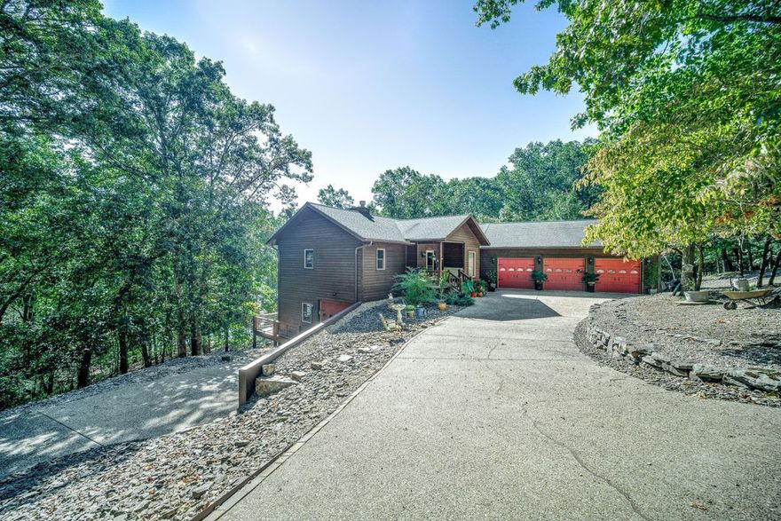 Wow! This is the one you have been waiting on!!  Lake front home tucked in a wide deep cove, it has all the things! Superb lake appeal from the time you drive onto a private 8.4 acre wooded lot. From the living room experience soaring vaulted ceilings, wide plank oak hardwood floors, updated kitchen, and lots of windows to enjoy the views Beaver Lake. There are lakeside decks on both the main level and basement level. Two en-suite master bedrooms on the main level, and downstairs you will find the third and fourth bedrooms, family room, kitchen, and loads of storage.  Private 1 slip (10x24) dock at the shoreline. Located at the north end of Beaver Lake, known for the jumping rock, and beautiful water clarity.