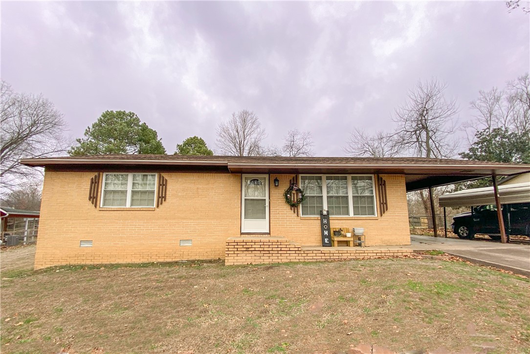This charming 3 bedroom home has been updated and is move-in ready for you. The kitchen is remodeled with granite counters, new stove, microwave etc. The bathroom remodel includes granite counters, new fixtures, and walk-in shower. The roof is less than 3 years old, and HVAC system is brand new as of 2023. Spacious and flat back yard includes two storage buildings, both on concrete pads. (14x24 and 8x12). Over sized laundry room provides some flex space for an office desk or extra storage. Located on a quiet street in Pea Ridge, and around the corner from restaurants, coffee shops, and all that the growing town of Pea Ridge offers. Well-maintained home and incredible price. Don't miss it. Fridge to convey with acceptable offer.