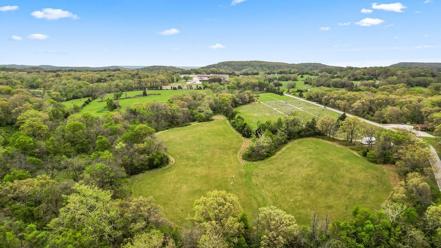 Nearly 26 acres for pasture or development on Hwy 127. 10 minutes to Lost Bridge Village Rec Center, 14 minutes to Ventris or Lost Bridge boat launches, and just 20 minutes to downtown Rogers. Perimeter fencing. Water and electricity at the street. A perfect spot for a small homestead. Enough open pasture and wooded acreage for anything your hobby farm heart desires!