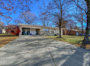 Newly remodeled home in ideal location for first time home buyer or great place to raise your children. This 3 bed, 2 bath brick home is located just a short distance from the Berryville Square and only a couple of miles from schools, Walmart, and local hospital. Hardwood floors have been refinished to original sheen and are in excellent condition. Interior is in the process of being entirely repainted and house has new interior and exterior doors. Bathrooms are recently updated making the half bath into a full bath. It has a 2 car carport and there is a workshop in completely fenced back yard. Kitchen is modern and spacious. All of this on 1/3 of an acre lot. Seller offering a $10,000 window allowance.