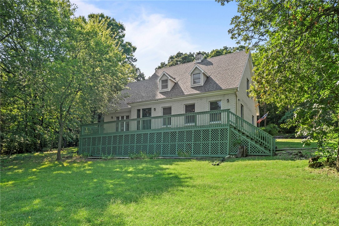 Welcome to your dream country home! Nestled on 1.68 beautifully wooded acres, this spacious 2,538 sq. ft. home offers the perfect balance of peaceful seclusion and convenient access to townājust minutes away, yet a world apart. This family-friendly home features 3 generous bedrooms, a versatile bonus room (could be 4th bedroom if needed), and a dedicated office/studyāideal for working from home or creating a quiet homework haven. Surrounded by mature trees and scenic views, every window invites nature inside. Step outside to enjoy the stunning outdoor spaces: a large back deck with a breathtaking view, perfect for family barbecues and quiet mornings, and a welcoming front porch framed by tasteful landscaping.With a new roof installed in 2020, this home is move-in ready and built to last. Whether you're hosting gatherings or enjoying a peaceful evening under the stars, this home offers space, comfort, and serenity for your entire family. Donāt miss your chance to own this private slice of country paradise!