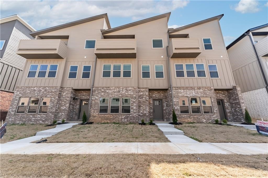 Gorgeous new construction townhome! This town home is just minutes from the interstate & the University of Arkansas. This home has a gorgeous view from the upper balcony, granite counter tops, large closets, & a custom interior design! The rooms are spacious. It offers a split floor plan. There are 3 bedrooms PLUS an office PLUS a second living room! The second living allows for the perfect space for entertaining guests, plus has a storage closet. Refrigerator, Washer, & Dryer included.