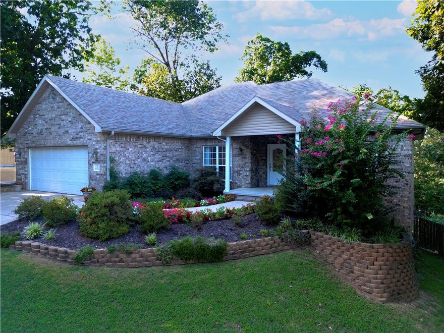 Private wooded retreat with finished walk-out basement and outdoor living spaces in the heart of Bella Vista. Welcome to a beautifully updated home that blends comfort, craftsmanship and outdoor living on nearly half an acre. Inside you'll find over 2600 sq ft of flexible space including a bright main-level living area with crown molding & hardwood floors, a chef's kitchen with granite counters & custom cabinetry and a spacious primary suite with walk-in closet and spa-like bath. The walk-out lower level offers a media room, game space and extra storage - perfect for entertaining, hobbies or a private guest retreat. Step outside to enjoy your own private oasis: a large deck for morning coffee, a fire pit for evening gatherings and a fenced yard with mature trees that creates a quiet, park-like setting. Other highlights: Thoughtful upgrades throughout, 2 car garage plus a shed for tools and toys, convenient access to trails, lakes & golf courses that make Bella Vista one of NW Arkansas' most desirable communities.