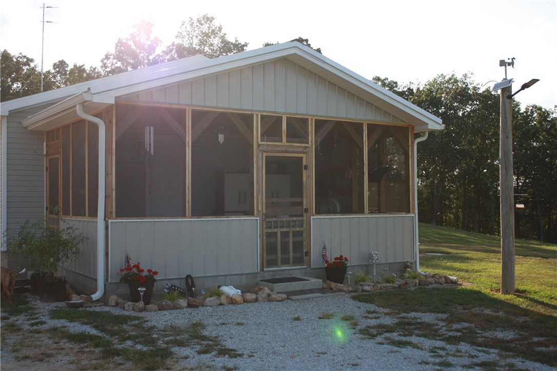 Charming 2 BR Custom Home with Guest Cabin in Harrison, AR **Main Residence:** The custom home is built to endure hurricane winds. Constructed with sturdy 2 x 6 walls and rafters. **Guest Cabin:** A fully equipped 15x30 guest cabin with screened porch, mini-split system for year-round comfort. Great for visitors or as a rental opportunity. The property also includes RV hookups. **Land Features:** Spanning 5.75 acres, the property boasts a well-established and cleared pasture or beautiful yard, ideal for agricultural pursuits or livestock. An additional 4.25 acres of wooded land with select cut clearings offers a perfect setting for hunting enthusiasts or nature lovers. **Additional Structures:** The 2 car garage has side room for another guest room or workshop. Two 30 X 16 metal buildings with 2x4 rafters & walls. **Septic System:** well-designed septic system with a leach field consisting of 5' x 100' pipes wrapped in a geotextile fabric, automatic valves. Don't miss this unique property!
