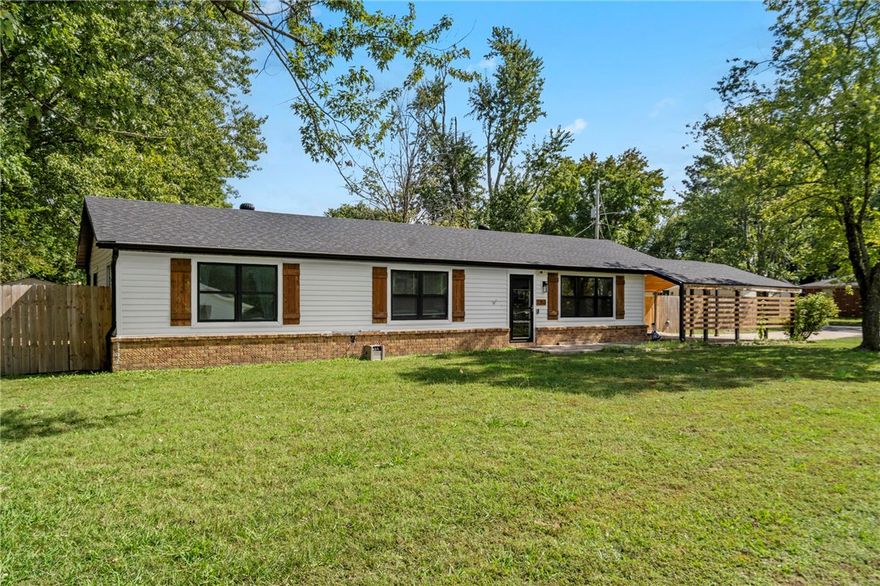 This fully remodeled home puts you right in the center of it all, offering easy access to everything that makes Bentonville one of the most desirable places to live. Step outside and walk or bike to Thaden School, 8th St. Market, the Walmart Home Office, or the Square, all just minutes from your front door. Inside, you’ll find a beautifully renovated interior featuring granite countertops, a spacious kitchen with a large island, and an inviting living area centered around an electric fireplace. Outside, unwind beneath the brand new gazebo or get creative in the heated and cooled workshop, perfect for an office, studio, or she shed. With a new roof in 2020 and thoughtful updates throughout, this home delivers modern comfort in a truly unbeatable location.