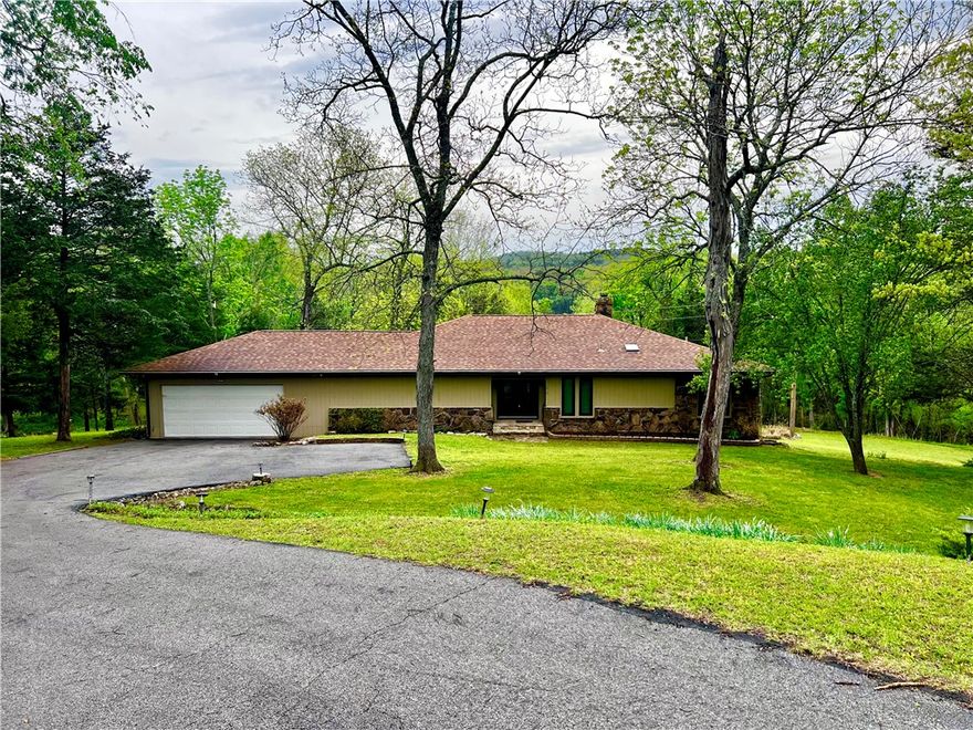 Sprawling lakefront retreat with easy walking access to the waters edge. This large home has lots of interior and exterior entertaining spaces. There is even a swanky wet bar built in for ease of serving guests. The sunken living room is open and inviting with a large stone wall fireplace surround and an entire wall of windows overlooking the totally amazing sunroom and showcasing the landscaped back yard with a lovely year round view of Table Rock Lake. The well appointed Primary bedroom has a private en suite bathroom and multiple closets with additional storage to keep things tidy. There are two nice sized extra bedrooms and even a private office located just off the living room. The kitchen was recently remodeled and updated with new countertops and stainless appliances. Enjoy easy access to the grill in the sunroom with a private staircase from the kitchen. The garage will leave you speechless, plenty of room to park your truck, boat and the golf cart! Island Marina, Pool, Playground & Golf all within 1 mile.