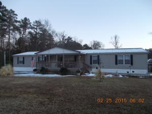 Well maintained double wide with a permanent foundation sitting on 1 lovely acre. Home features 4 bedrooms, 2 baths, fireplace, two living areas and super large master bedroom. New metal roof & carpet.All appliances convey including washer,dryer & freezer.Carport with workshop, 10X40 covered deck with view of pasture & wildlife.Even the greenhouse conveys. Very close to Lake Nimrod.Priced to sell