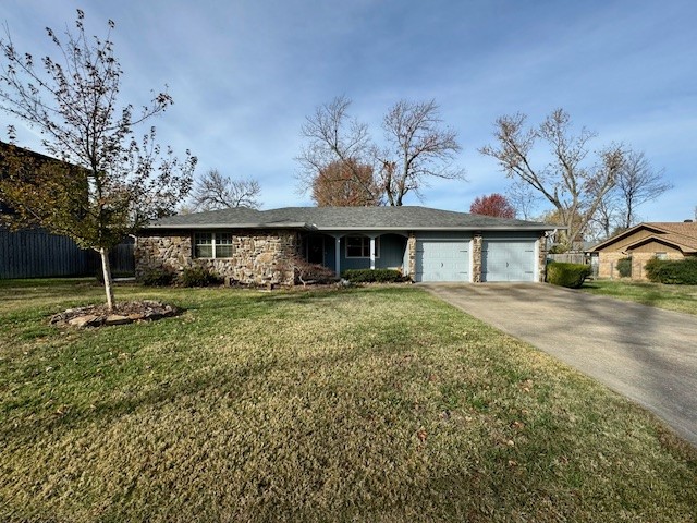This one-level home is nestled along a quaint and quiet street in Downtown Bentonville just steps from the Square, trails, parks, shopping and restaurants. Beautiful native stone and a cozy front porch will welcome you to this 3 bedroom 2.5 bath home situated on a large irrigated and professionally landscaped lot. The spacious and renovated kitchen has an induction range, granite countertops, large island, coffee bar and an abundance of cabinet storage. Ideal for entertaining, this home boasts two living areas one with a fireplace and both with easy access to kitchen. Features include hardwood floors throughout most of the house and brand newer carpet in the bedrooms. The primary bedroom hosts en-suite bath, three closets for storage and lots of natural light. A truly spectacular home in the heart of Bentonville!