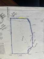 wooded property which slopes to creek in apprx center of property