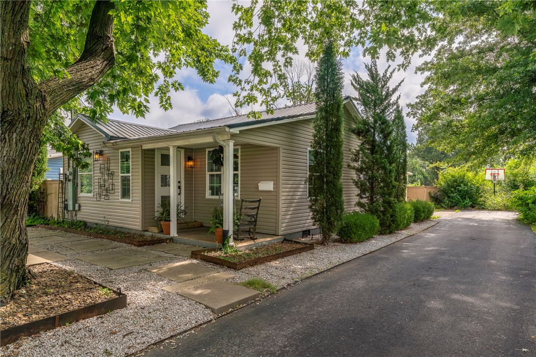 Adorable Bentonville cottage just 6 blocks from the Squareāprime location with serious potential. Whether you're dreaming of an second home, Airbnb, long-term rental, or future build, this one checks the boxes. The lot alone is worth the asking price. Side alley access, a large 1-car garage + carport = rare storage for bikes and gear. Quiet street with direct access to Park Springs Park and world-class mountain biking trails. Inside: 3 beds, 2 baths, hardwoods throughout, and a spacious primary suite with ensuite bath. Metal roof, towering shade trees, and walkable to Airship Coffee and all things downtown. Biking capital, food mecca, art hubāthis is the heart of it all.