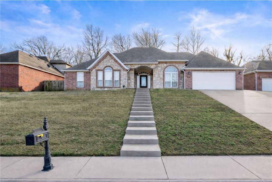 PRIME LOCATION! This well-maintained home offers 2 inviting living spaces w/a functional layout designed for everyday comfort. Gorgeous newer cherry-like hardwood floors thru-out, living area w/a cozy FP is open to kitchen, 4 spacious bedrooms, & a practical kitchen with granite c-tops & Custom Wood Cabinetry. This home is ideal for both relaxing and entertaining. Newer items include Water Heater (2019), Roof (2020), AC (2022), & Dishwasher (2025). Enjoy the patio & deck overlooking the privacy fenced yard perfect for outdoor gatherings or quiet evenings at home. The location is hard to beat—just minutes from Lake Fayetteville, Springdale Golf Course & Country Club, I-49, & the Razorback Greenway biking & walking trailhead. Close to shopping, dining, schools, & major employers. All of this combines convenience, lifestyle, & value in a desirable location.