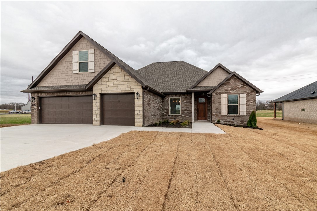 Brand new development in East Tontitown. This plan offers an open concept living area with split floor plan with all bedrooms on main level while upstirs features a large bonus room or 5th bedroom with its own bathroom. This house also includes soft close cabinet drawers in kitchen and master bath, security system, prewired for surround sound in living room and back patio, an upgraded appliance package, designer lighting package, blinds, gutters. Less than 20 minutes from the Tyson World Headquarters. Additional concessions include $7500 in closing costs from the builder and up to $5000 from a preferred lender.