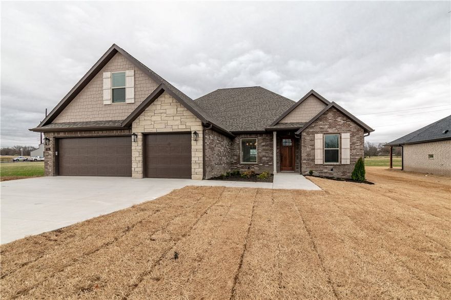 Brand new development in East Tontitown. This plan offers an open concept living area with split floor plan with all bedrooms on main level while upstirs features a large bonus room or 5th bedroom with its own bathroom. This house  also includes soft close cabinet drawers in kitchen and master bath, security system, prewired for surround sound in living room and back patio, an upgraded appliance package, designer lighting package, blinds, gutters. Less than 20 minutes from the Tyson World Headquarters. Additional concessions include $7500 in closing costs from the builder and up to $5000 from a preferred  lender.
