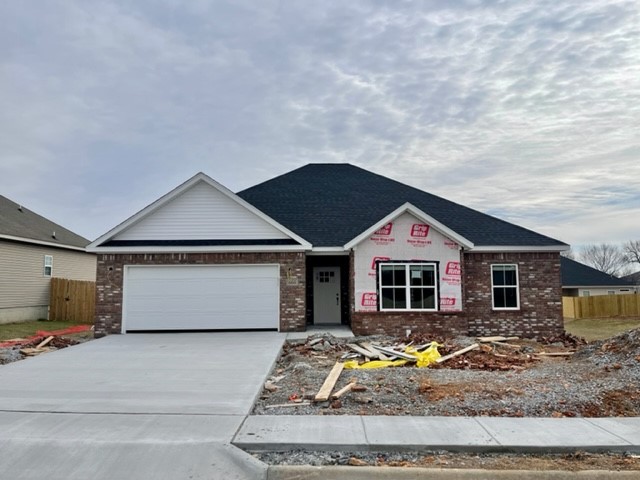 Very nice Brand New Construction 3 bed 2 bath home just minutes from Downtown Bentonville and Walmart Home Office. This property includes a privacy fenced yard, ceramic wood look tile, gas log fireplace in the living room granite counter tops, 2" faux wood blinds, custom tile shower in master and much more!