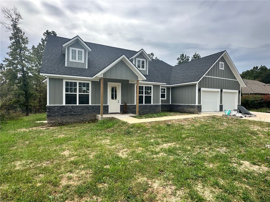 Seller to pay up to $5k towards Buyers Closing Costs & Prepaids AND provide a washer, dryer, and stainless steel refrigerator with full price offer. New construction home in the Bella Vista area. Sodded front yard, seed & straw on the side & backyard. 3 bedrooms / 2 bath home with Stainless Steel appliances. Kitchen has 2cm quartz and marble backsplash along with a stainless steel gas/propane cooktop and oven, a microvent, and dishwasher. Living room has a gas/propane fireplace with tile surround. Ceiling fans throughout. Primary bedroom has bathroom suite with a separate soaker tub and tiled oversize shower, dual vanity sinks, and 2 cm quartz countertops. Disc lights, ceiling fans, and 2” faux wood blinds throughout the home. 

Owner is related to a realtor. Owner is related to the builder. Builder is a licensed real estate agent with Crye-Leike Realtors of Siloam Springs. Taxes are based on the land only and will increase when re-assessed.