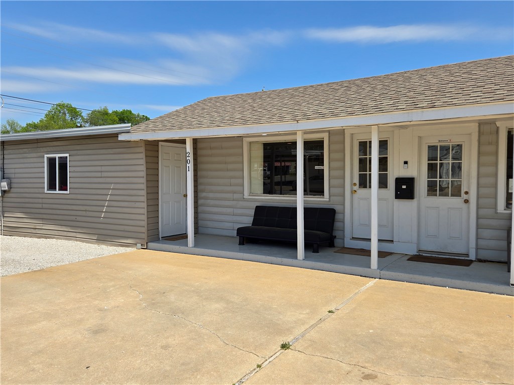 Commercial opportunity on corner lot near downtown Siloam Springs. Situated with 50 feet of road frontage on Main Street this property offers excellent opportunity for a variety of businesses. 32x12 building houses two separate offices, 1 bathroom, each office with its own entrance, offering flexible options for operations or rental income. Site features an 18x18 garage w/overhead door & walk-through entry, plus 11 covered bays with lightingāperfect for vehicle storage, workspace, or service use. 10x14 storage building w/electricity & an awning, two large picture windows at the front, & updated electrical throughout (2023). The property has new water lines and received a full exterior paint refresh in 2024. Property features can lighting, tile & vinyl flooring, and Cox high-speed internet and Ring doorbell. With its functional layout, recent upgrades, and prime location, this property is ideal for automotive, retail, service, or office use. Zoned commercial and move-in ready. Previously a successful car dealership.