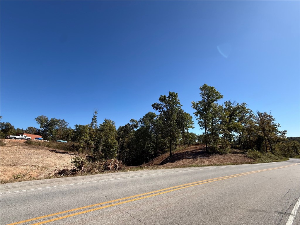 This 5.58-acre property offers privacy while remaining accessible to Bentonville, just 3.5 miles to Walton Blvd. The Seller and Listing Agent are a Custom Home Builder and will build a home to suit. A plan is drawn and attached to the listing. The property has an on-site water meter, with electric requested. Sewer will be a septic system, and propane will be required for gas appliances.