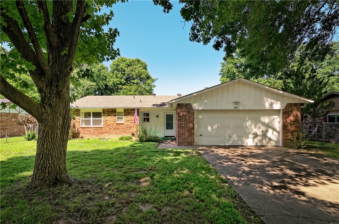 Classic ranch-style home located near many amenities in established neighborhood. This three-bedroom, two-bathroom home has brick fireplace and galley kitchen with new glass-top stove and three-year old dishwasher. Two-car garage has work benches and insulated garage door. Roof is new 2020. HVAC approximately 2018. Vinyl windows and sliding door have been installed. Large, backyard has covered patio. Gas grill, refrigerator, washer and dryer convey with sale of home.