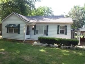 Seller Wants Sold! Clean home with a nice lot. New CH/A, steel siding, private backyard, enclosed porch, 2nd bath at back of home, newer vinyl tile and carpet. Vinyl 2-pane windows and is a good home that is ready to move into. Large outbuilding with a concrete slab and nice landscaping included. Was $55,000 now 49,900