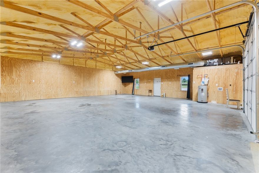 8975 Madison 6041 – 1.47 Acres with Endless Options 4800 heated and cooled sq ft. Built in 2022 This property offers the perfect blend of quality construction, functionality, and flexibility—all on 1.47 acres. Whether you’re looking for a well-built home, shop, or even a place to run your business, this one has it all. Spray foam insulation throughout for efficiency Central HVAC system Full-length front and back porches to relax and enjoy the outdoors 12-foot garage doors for easy access and oversized equipment Bonus home, shop, or business space included Full gravel parking lot with plenty of room Fenced backyard for privacy and security Built with care and designed for multiple uses, this property is ready to fit your vision. Appliances do not convey.