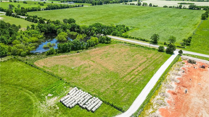 Development Potential! FIVE flat open acres on hwy 72!! This property is located between Downton Pea Ridge and the Pea Ridge Military Park with Hwy 72 road frontage, all in one of the area’s fastest-growing communities. Shallow small pond located on the property.