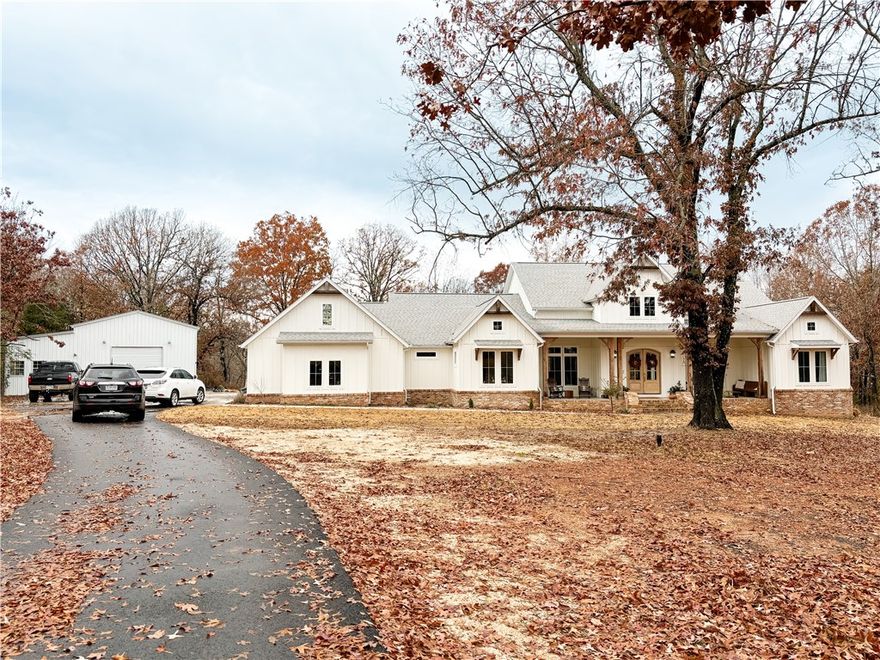 Nestled in a tranquil park-like setting, near a pond and 12 acres of wooded trails, this exquisite 4-bedroom, 3.5 bath home blends modern luxury with timeless charm. Boasting an open-concept layout, the kitchen space allows you to enjoy a large space. The master bedroom is spacious and the master closet is just as big. The shop building is 30x40 which 300 sq feet is heated and cooled with its own fully functional bathroom that you can Airbnb or use for guests. The yard is cleared, but the land is full of trails, woods, and hunting.

Antique brick, Zellige Tile, Pond, Privacy, Custom, 22' Ceilings, Limestone Fireplace, Wood Beamed Ceiling, Outdoor Fireplace, Quartz Countertops, Brass Fixtures, and more.