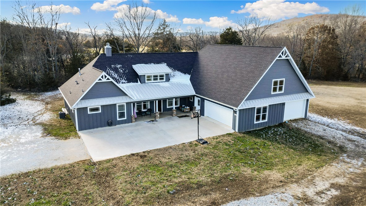 Make this house your own and enjoy the almost 8 acres that surrounds you. Enjoy sunsets from the
covered back patio while taking a swim in the pool. Property has an RV pad with electricity and water is ready to be set up to the pad. House has concrete floors, has open living room and kitchen for you to entertain. The floor to ceiling stone wood burning place with hearth is the centerpiece of the living room. 4 bedrooms with a private office space. Huge unfinished space above garage is floored and wired with electrical and could easily be made into game room, media room, play room etc.
Master bath boosts a double entry shower and a stand- alone soaker tub. Seller offering $5,000 flooring allowance with a good offer.