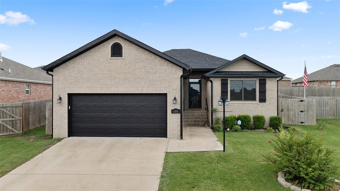 Located right by Allen Elementary, Siloam Springs Intermediate school, and Aquatic Center! This well-maintained 4 bedroom, 2 bath home features an open floor plan, crown molding & gas fireplace in the living room, granite countertops throughout, pantry & Frigidaire appliances in the eat-kitchen. There's extra cabinets in the laundry room as well. The back yard has a privacy fence and a 12 x 16 outbuilding with electricity. The front yard has extra lighting along the sidewalk and in the flowerbeds that is on a timer. Enjoy stress free living with a brand new roof and gutters (July 2025) and a 2-yr old water heater.