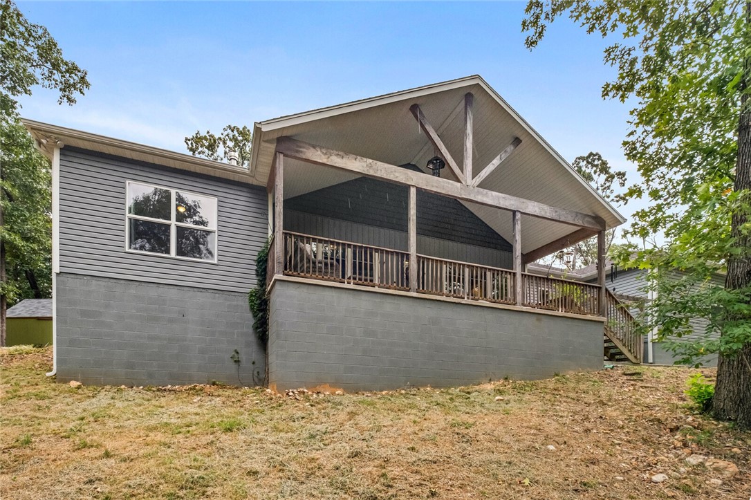 Welcome to the Hodge Lodge- where your homestead dreams become reality. You will love the private 5-acre nature setting of this 2020 home. Sit on the front porch with your coffee and watch the hummingbirds, deer and the rest of nature come to life. After a day of foraging for wild morels & blackberries (just to name a few) or front entry garden, take a relaxing soak in the primary's claw foot tub. Warm up this winter by the fireplace with a good book from the library built-ins. Meals are a breeze in the open kitchen with large island. Step out back to the bird habitat for those fresh eggs. For the young- or young at heart, take a tree covered stroll to the fairytale tree house with climbing wall. Shop is perfect for your next project or added storage, though the oversized garage provides plenty of extra space. For security you will love the peace of mind with the built-in storm shelter and generator hook up. All wrapped in this nature loving home. Only 15 minutes from I49. Come and see!