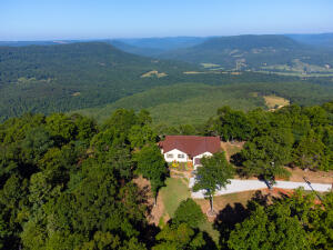 If you love Hawksbill Crag, you will love this property with your very own private crag, hiking trails, private camping spots & million dollar view overlooking Parthenon Valley. It is at the very end of the road with seclusion, walking trails, camping spots and picnic areas. The immaculate, all one level, beautiful house was finished in 2020, features gorgeous heated wood floors, custom wood cabinets with soft-close doors, space-saving slider doors, granite countertops, custom kitchen island, stainless steel appliances, garbage disposal,