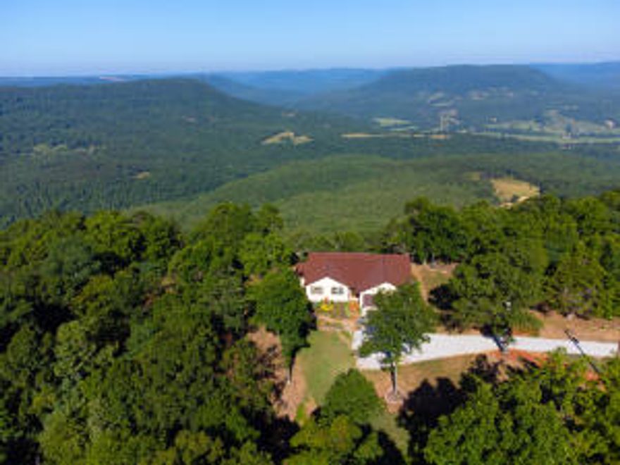 If you love Hawksbill Crag, you will love this property with your very own private crag, hiking trails, private camping spots & million dollar view overlooking Parthenon Valley.  It is at the very end of the road with seclusion, walking trails, camping spots and picnic areas.   The immaculate, all one level, beautiful house was finished in 2020, features  gorgeous heated wood floors, custom wood cabinets with soft-close doors, space-saving slider doors, granite countertops, custom kitchen island, stainless steel appliances, garbage disposal,