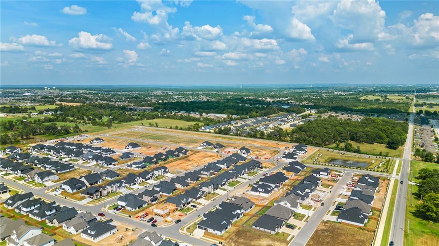 Discover the perfect balance of elegance and functionality in this impressive 4-bedroom, 4-bath home. Thoughtfully designed, the layout and premium finishes truly set it apart. The main level features the luxurious primary suite along with a secondary bedroom and full bath for added convenience. Upstairs, you’ll find two additional bedrooms, two bathrooms, and a spacious game room—perfect for entertaining or relaxing—with easy attic access for practical storage. The heart of the home is the inviting eat-in kitchen, complete with granite countertops, custom cabinetry, stainless steel appliances, and hot water recirculation. An open-concept design, curated lighting, and energy-efficient touches—including spray foam insulation and low-E windows—enhance both comfort and style. Future Phase 2 amenities will elevate the neighborhood with a pond, walking trails, clubhouse, and pool. All of this in a prime location—just under 20 minutes to Downtown Bentonville and the new Walmart Home Office, and only 15 minutes to XNA.