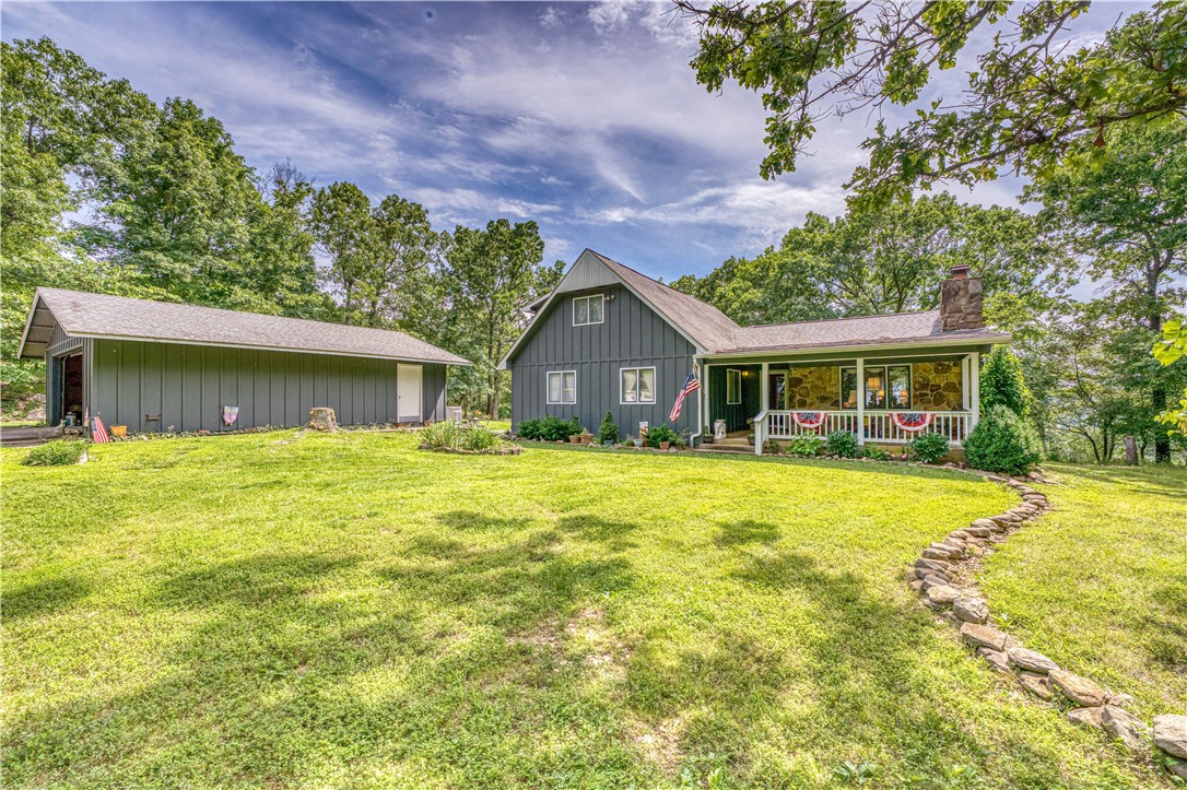 This is truly a once in a lifetime property! With over 197 absolutely gorgeous acres of lush mixed grass pasture, mature hardwood and cedar timber, rock outcroppings, boasting over 1,800 ft of Crooked Creek access, year round spring fed creek through the property, paved road frontage, large metal barn, shed, 3.000+ square ft, 5 bd, 3 ba home, Generac generator, and distant views This property located in the heart of the Ozarks with a short drive to the White River, Buffalo River and National Forest, Bull Shoals Lake, Table Rock Lake, and much more. If you miss this one there just isn't another like it!