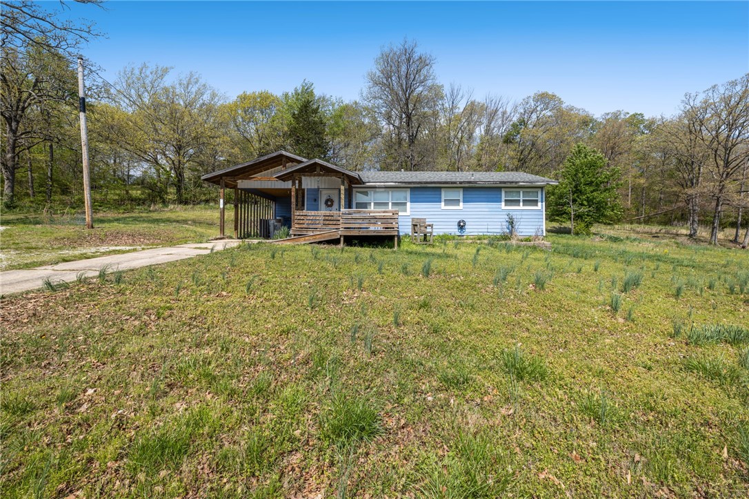 Escape to peace and privacy with this charming 3 bedroom, 1 bath home nestled on 2 beautiful acres near Lake Sequoyah. Perfectly blending natural serenity with convenience, this property offers an ideal retreat for outdoor enthusiast, and first time home buyers. Garden, play, build, or simply enjoy the peaceful wooded surroundings. With plenty of space for expansion or outbuildings, this is a rare opportunity to own a slice of tranquility just minutes from the heart of Fayetteville.