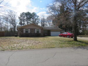 DELIGHTFUL DWELLLING WITH LARGE LIVING SPACES! This gorgeous home has a fantastic floor plan! Beautiful family room loaded with full length windows. Built in bar! ALL APPLIANCES CONVEY including washer and dryer. Water heater is one year old. New sewer line has been installed. HVAC has been serviced for the year, and new thermostat installed. Wonderful built in STORM SHELTER--access through the master bedroom closet and another access from the exterior. Popular subdivision. Conveniently located to schools, shopping, Aquatic Center.