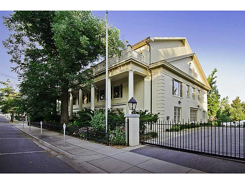 Large luxury condo on quiet street 2 blocks North Fayetteville Square w/views of Old Main. Quality custom finished in 2004. One owner. Hardwood floors, wood windows, skylights, wet bar, 2 fps, 2 jacuzzi tubs, steam shower. Timeless professional decor with,every upscaled detail! 13'x11' laundry, storage. LARGE prof. designed his & her closets. Trees shade the private screened porch and 21x11 balcony. Fitness ctr in bldg, 5 condos total. On site parking, fully fenced w/elec gates. POA for yard.
