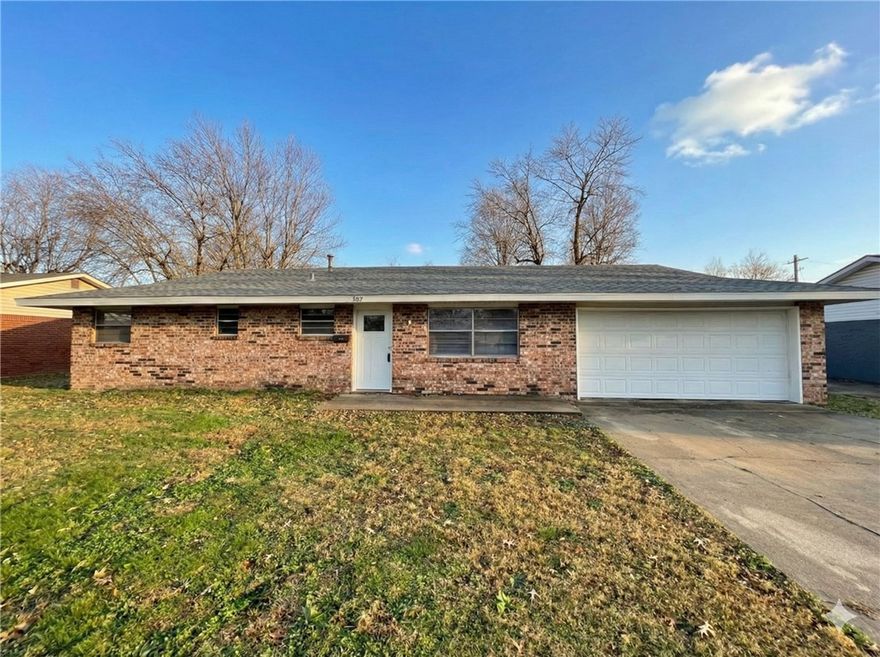 Nestled in central Springdale near Highway 412W, this home puts schools, shopping, and dining just minutes away! With 3 bedrooms, 2 bathrooms, and a 2-car garage, there’s plenty of room to spread out. The spacious living area features a decorative rock hearth (fireplace is non-operational and hearth is purely ornamental) and flows to a working kitchen with a cozy dining space. A convenient utility room adds functionality, while the fenced backyard  and patio offers room to relax and for outdoor enjoyment. In addition, the roof is new. Perfectly located and full of charm—this one won’t last!