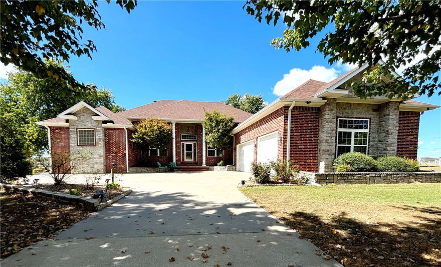 Come home to this beautiful country home. Experience some real peace and quiet in this unique property. Tree lined circle drive is sitting on 5.50 acres of flat fenced land perfect for horses or livestock. The primary home is 3,750 sq ft. Featuring 4 bedrooms 3 full baths, 2 living areas, formal dining room, eat in kitchen, massive primary bedroom, 3 car garage, covered back porch. Tons of upgrades throughout house, sinks, faucets, fans and fixtures. New roof 1 year ago. Connected to property in rear is a 614 sq ft, 2 bed 2 bath guest-house with attached double door workshop. Entire property is fenced and also offers a 1.5 mile shared trail for horses or hiking. All these amenities and still only a few miles from all the convenience of XNA. Don't let this one get away. Schedule your private showing today.