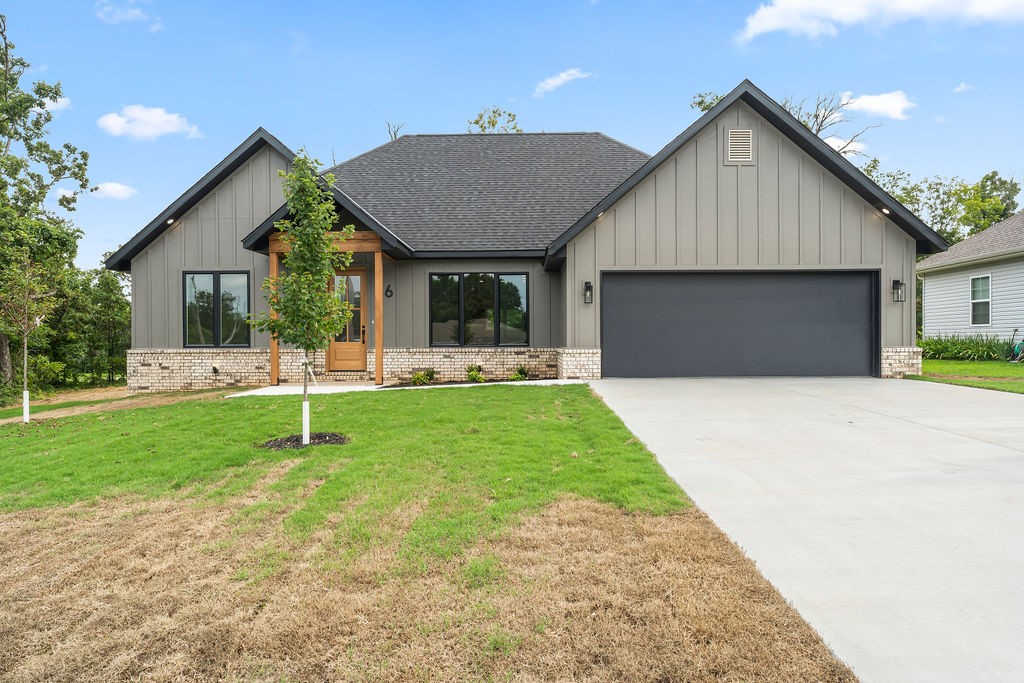 This new home features an open concept kitchen to living with vaulted ceilings, built-ins, tons of natural light, and plenty of modern flare. Quartz kitchen counters and an island with overhang for seating. Plenty of cabinet space and a pantry. LVP flooring throughout the entire home. Covered deck to look out into large, level backyard. One year builder warranty. Located just down the road from Tiree Park & Boat Dock. This beauty is done and ready for move-in.